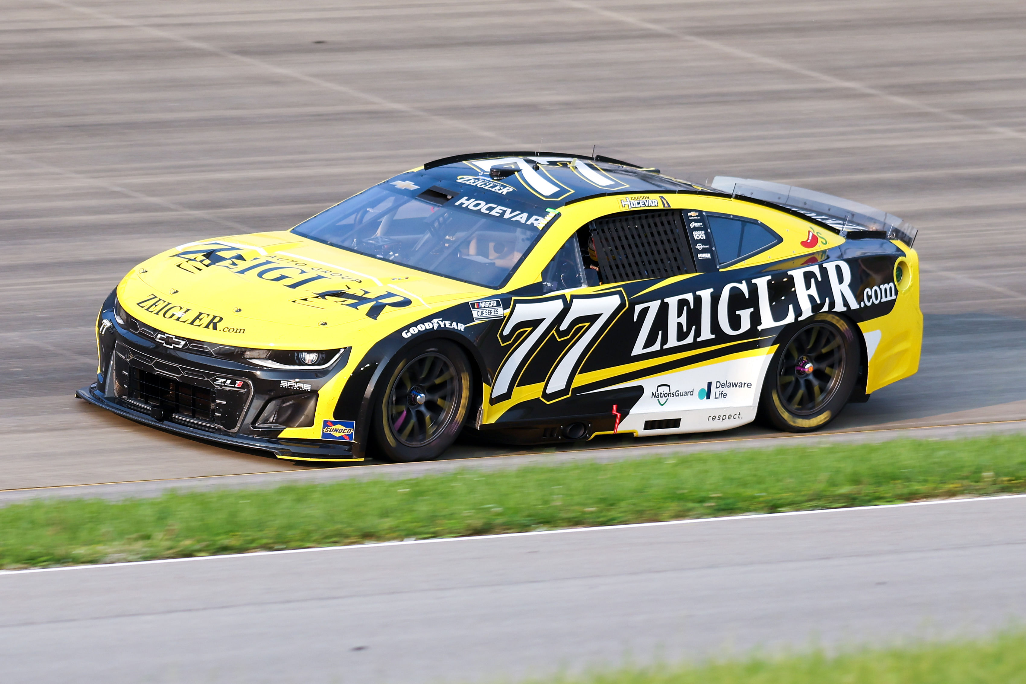 NASCAR Cup Series driver Carson Hocevar (77) of Spire Motorsports during the Cracker Barrel 400 at Nashville Superspeedway. Mandatory Credit: Randy Sartin-Imagn Images